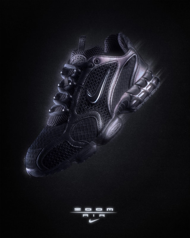 Nike Air Zoom Spiridon Cage 2 in black, three-quarter view on black, Zoom Air logo below