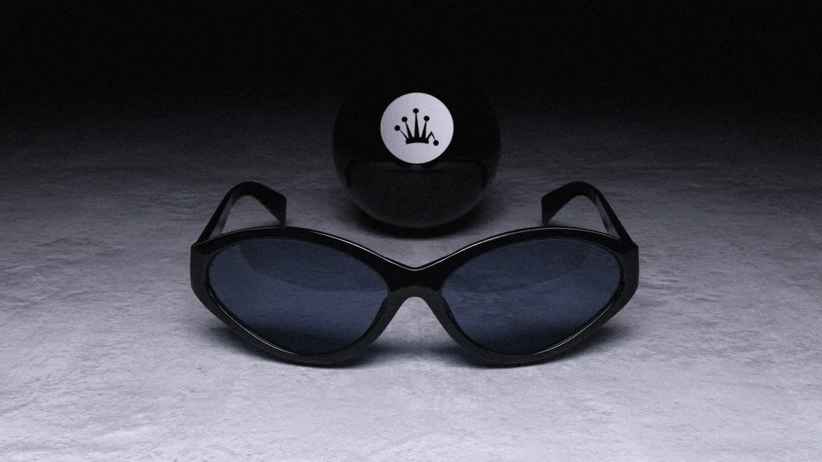Black Stüssy Eyegear sunglasses on concrete beneath an 8-ball with the Stüssy crown