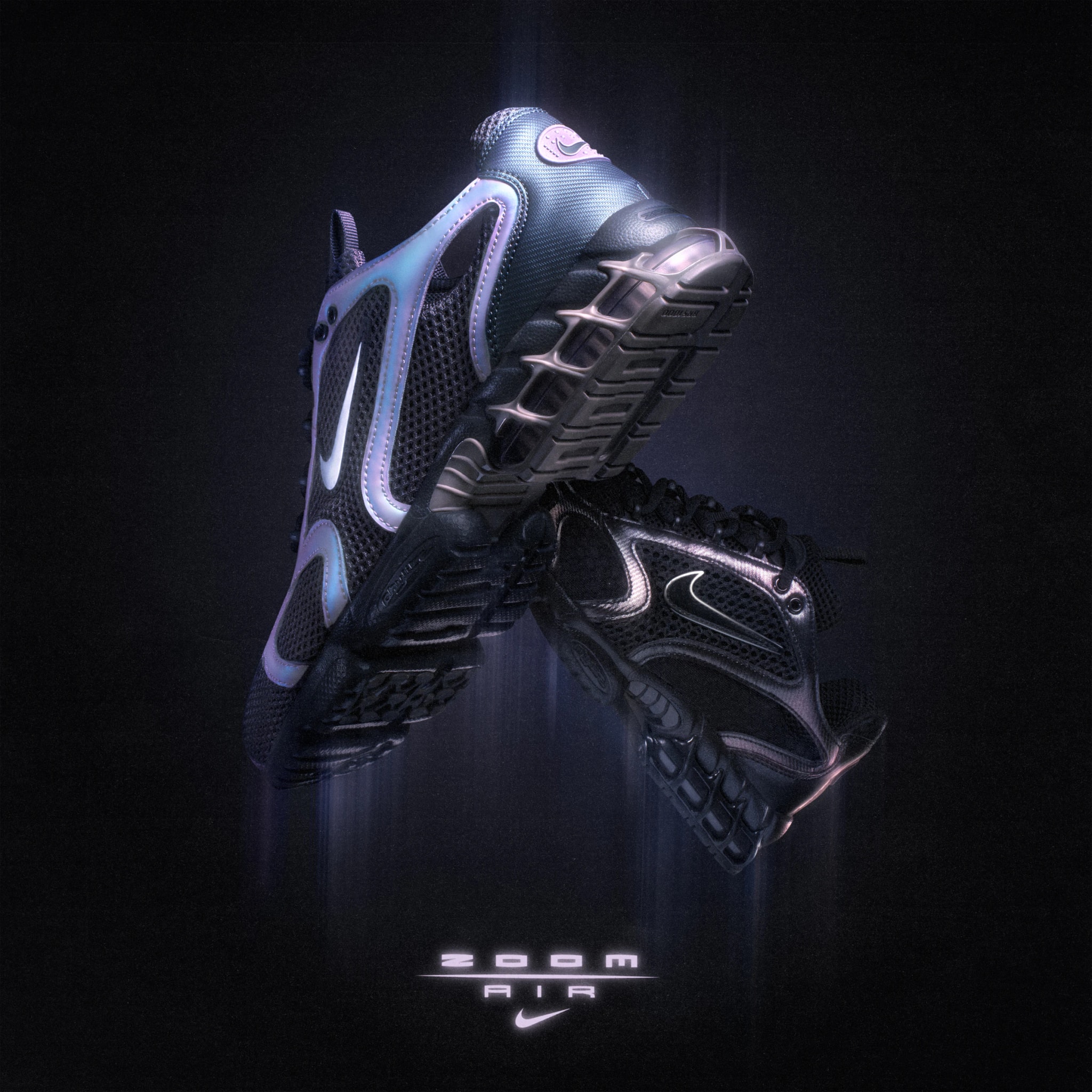 Two Nike Air Zoom Spiridon Cage 2 sneakers, iridescent and black, crossed in mid-air above the Zoom Air logo
