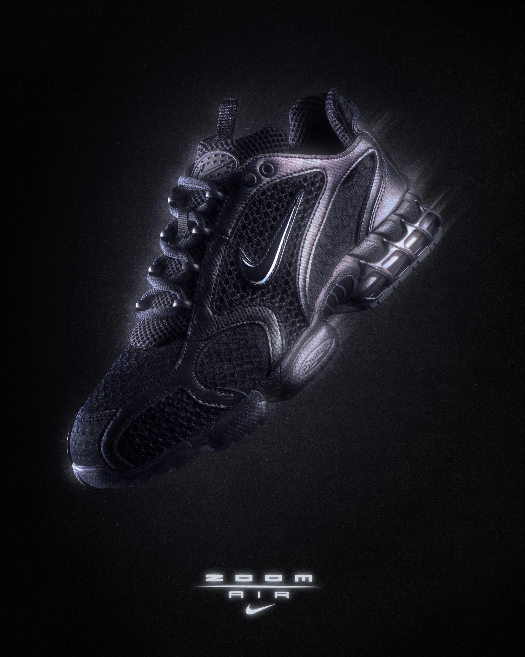 Nike Air Zoom Spiridon Cage 2 in black, three-quarter view on black, Zoom Air logo below